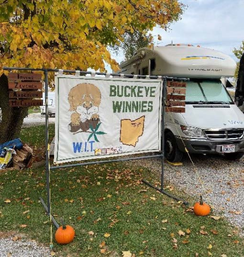 Buckeye Winnies sign next to parked motorhome.